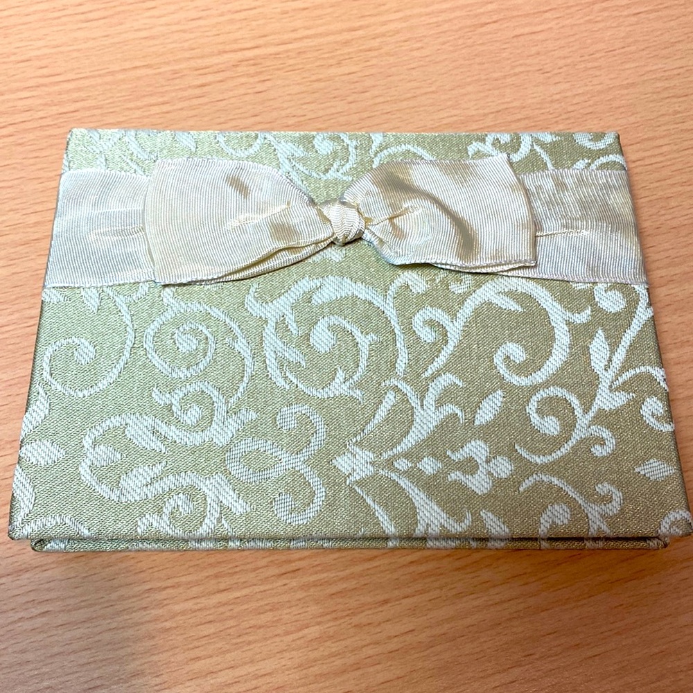 Small photo album in sage green. NWOT